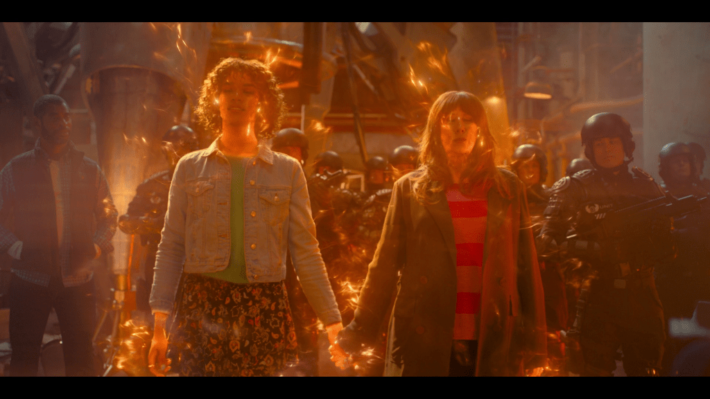 Rose (Yasmin Finney) and Donna (Catherine Tate) let go of the Human-Time Lord Meta-Crisis in Doctor Who Special 302 "The Star Beast" (BBC)