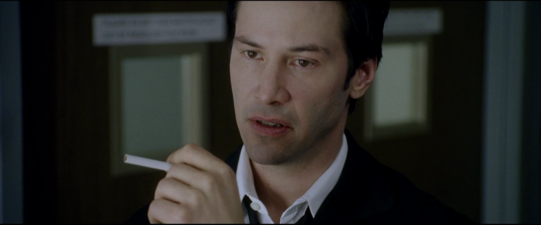 John Constantine (Keanu Reeves) receives some grave news concerning his favorite vice in Constantine (2005), Warner Bros. Pictures