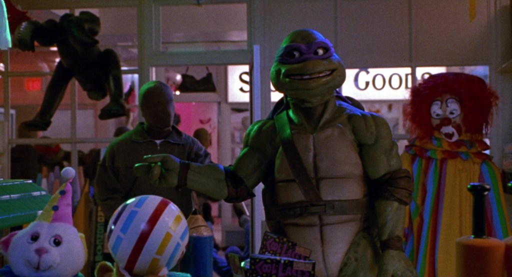 Donatello (Adam Carl/Leif Tilden) goofing around in Teenage Mutant Ninja Turtles: The Secret of the Ooze (1991), Golden Harvest