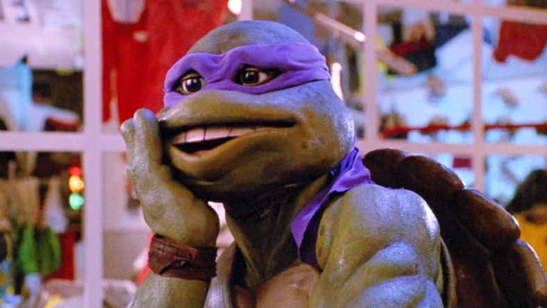 Donatello goes "Oops" after kicking a thug in Teenage Mutant Ninja Turtles II: The Secret of The Ooze (1991), New Line Cinema