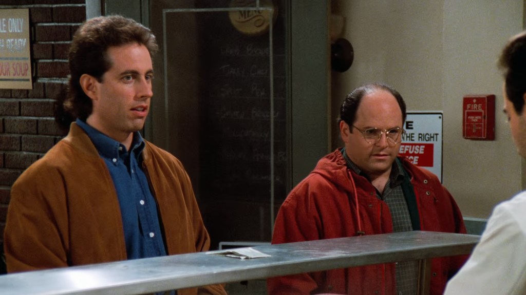 Jerry Seinfeld (Jerry Seinfeld) and George Costanza (Jason Alexander) order soup from the Soup Nazi in Seinfeld Season 6 Episode 7 "The Soup" (1994), NBC