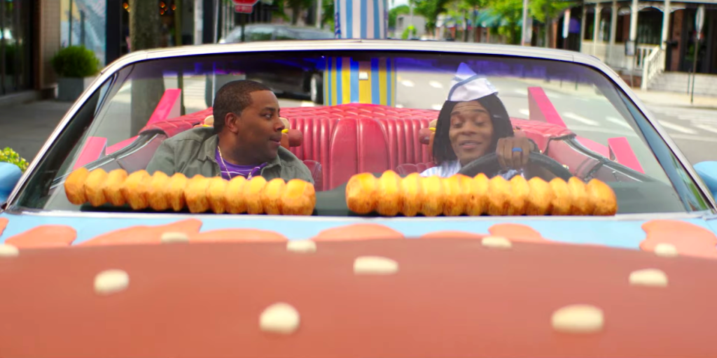 Dex (Kenan Thompson) survives being "car burgered to death" with Ed at the wheel in Good Burger 2 (2023)