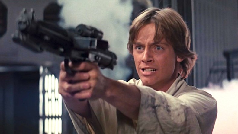 Luke Skywalker (Mark Hamill) blast some Stormtroopers in Star Wars Episode IV: A New Hope (1977), Lucasfilm