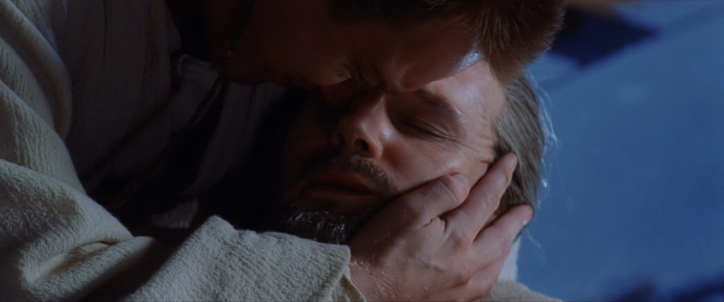 Obi-Wan Kenobi (Ewan McGregor) mourns the death of Qui-Gon Jinn (Liam Neeson) in Star Wars Episode I: The Phantom Menace (1999), Lucasfilm