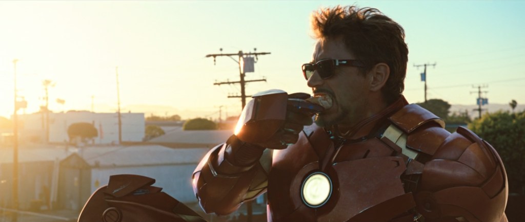 Tony Stark (Robert Downey Jr.) has a fatty snack to cure his birthday hangover in Iron Man 2 (2010), Marvel Studios