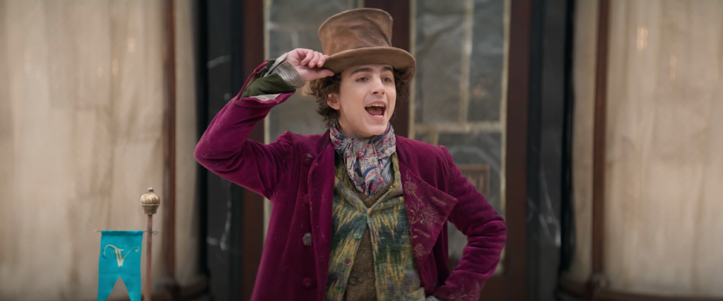 Willy Wonka (Timothée Chalamet) introduces himself to the world in Wonka (2023), Warner Bros. Pictures