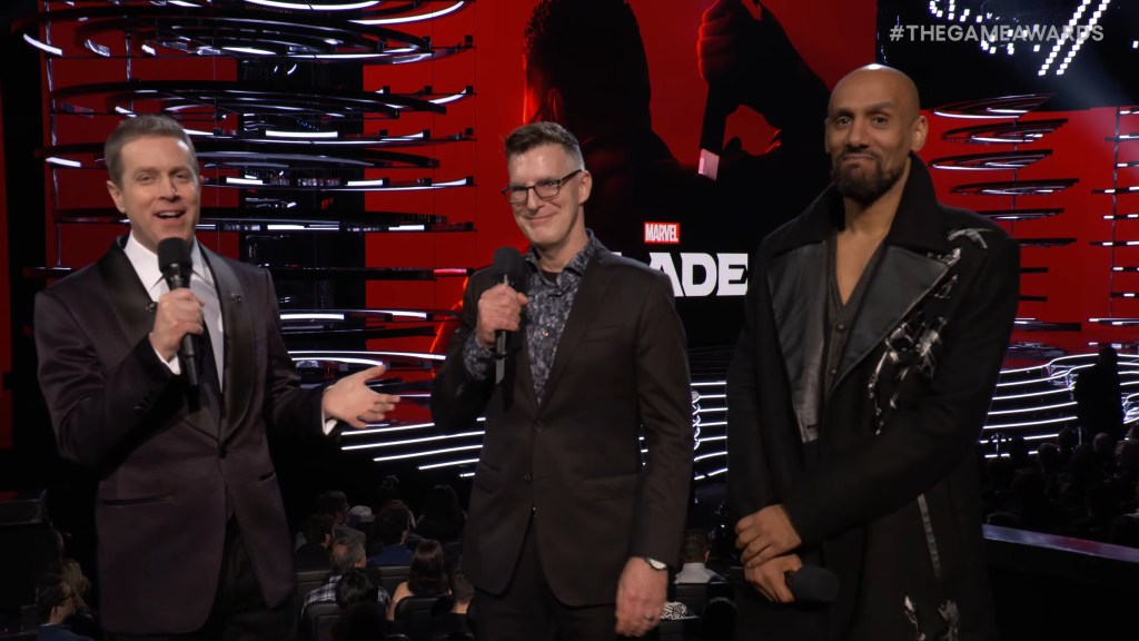 Geoff Keighly welcomes Marvel Games VP & Creative Director Bill Roseman and Arkane Lyon Studio Director Dinga Bakaba onstage at The Game Awards (2023)
