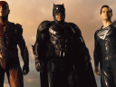 The Flash (Ezra Miller), Batman (Ben Affleck) and Superman (Henry Cavill) stand triumphant over Darkseid (Ray Porter) in Zack Snyder's Justice League (2021), Warner Bros. Pictures