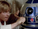 Luke Skywalker (Mark Hamill) attempts to fix his newly-purchased R2 unit (Kenny Baker) in Star Wars - Episode IV: A New Hope (1977), Lucasfilm