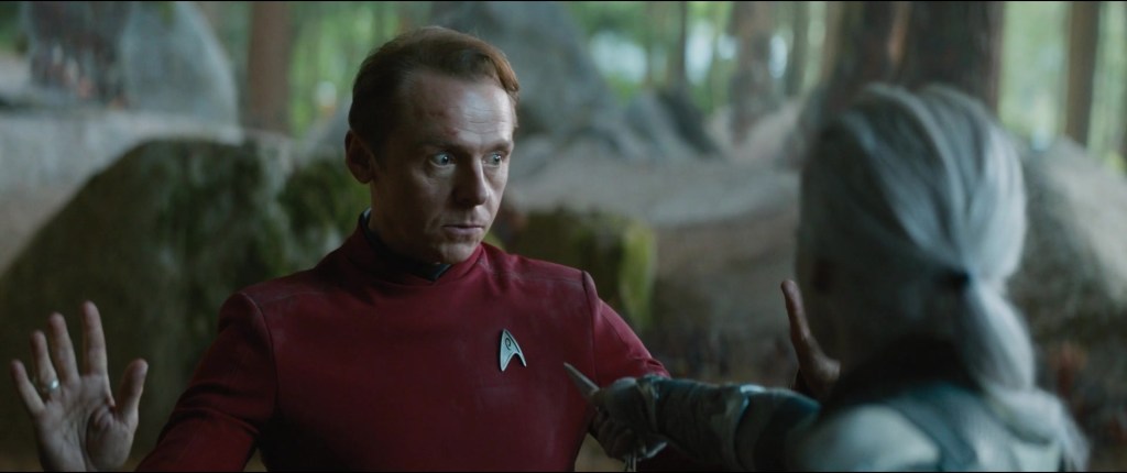 Scotty (Simon Pegg) finds himself at the mercy of Jaylah (Sofia Boutella) in Star Trek Beyond (2016), Paramount Pictures