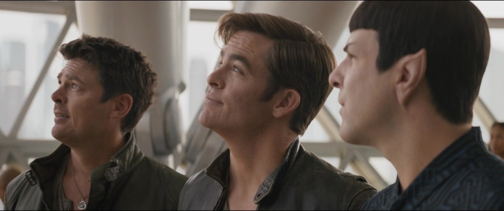 Bones (Karl Urban), Kirk (Chris Pine), and Spock (Zachary Quinto) look to the future in Star Trek Beyond (2016), Paramount Pictures