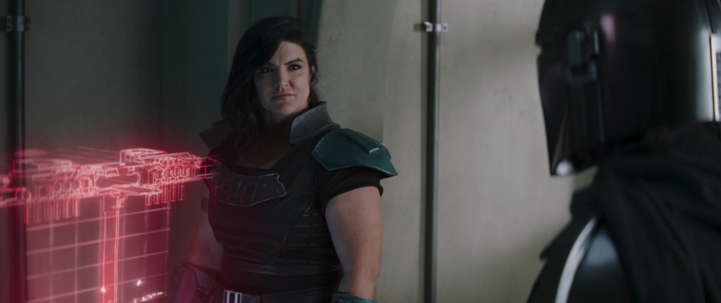 Cara Dune (Gina Carano) agrees to offer her help to the titular hero (Pedro Pascal) in The Mandalorian Season 2 Episode 4 "Chapter 12 - The Siege" (2020), Disney