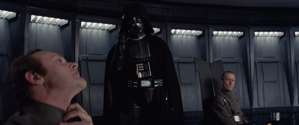Darth Vader (James Earl Jones/David Prowse) finds Admiral Motti's (Richard LeParmentier) lack of faith disturbing in Star Wars Episode IV: A New Hope (1977), Lucasfilm Ltd.