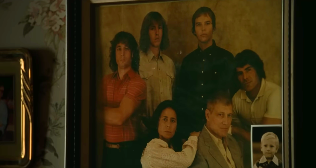 Von Erich family photo on the wall in The Iron Claw (2023), A24