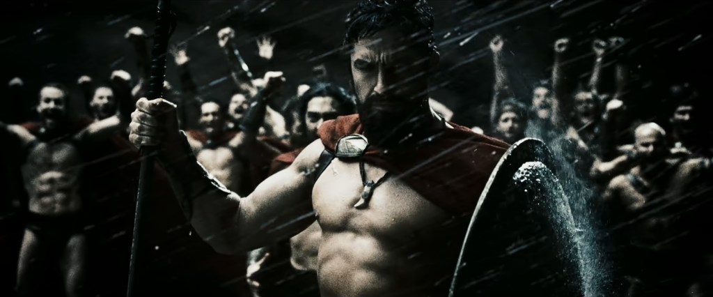 King Leonidas (Gerard Butler) keeps his Spartan reserve as he watches a fleet of Persian vessels sink in 300 (2006), Legendary Pictures