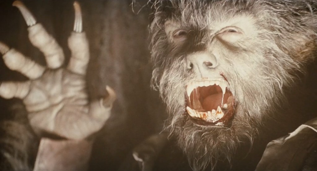 Lawrence Talbot (Benicio del Toro) attacks a frightened hunter in The Wolfman (20100), Universal Pictures