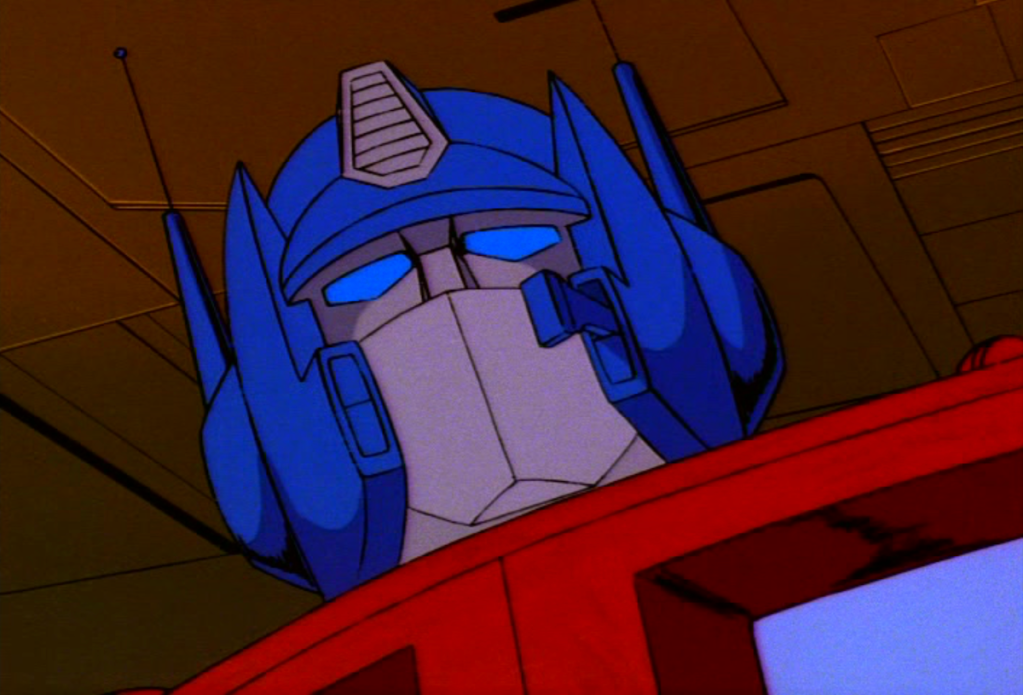 Optimus Prime (Peter Cullen) devises a plan of attack in Transformers Season 1 Episode 7 "S.O.S. Dinobots" (1984), Marvel Productions