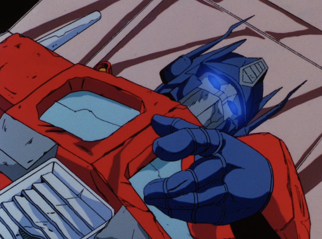 Optimus Prime (Peter Cullen) gives the power of the Matrix to Ultra Magnus (Robert Stack) in Transformers: The Movie (1986), Marvel Productions