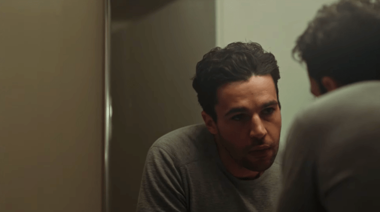 Christopher Abbott looks in the mirror in Possessor (2020), Elevation Pictures