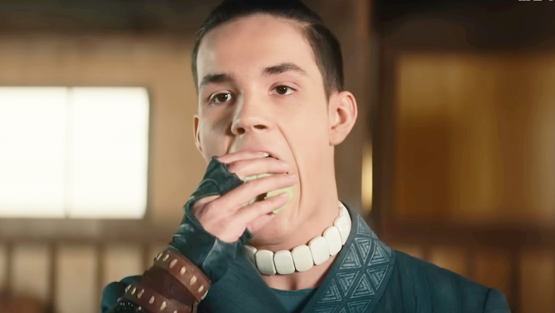 Sokka (Ian Ousley) grabs a bite to eat in Avatar: The Last Airbender (2024), Netflix