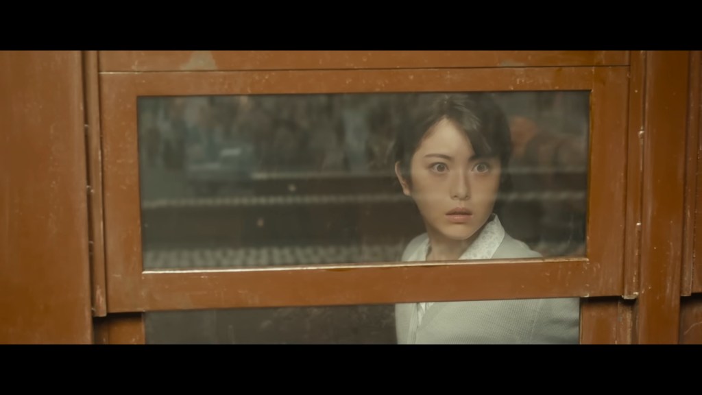 Noriko Ōishi (Minami Hamabe) is in awe as Godzilla surfaces in Godzilla Minus One (2023), Toho