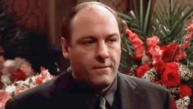 Tony (James Gandolfini) attends the funeral of his grandfather Thomas Giglione Sr. (N/A) in The Sopranos Season 2 Episode 6 "The Happy Wanderer" (2000), HBO