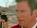 Captain Kirk (William Shatner) finds himself held at Phaser-point by Tolian Soran (Malcolm McDowell) in Star Trek Generations (1994), Paramount Pictures
