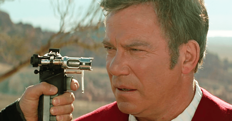 Captain Kirk (William Shatner) finds himself held at Phaser-point by Tolian Soran (Malcolm McDowell) in Star Trek Generations (1994), Paramount Pictures