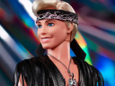 Ken unleashes his Kenergy via Mattel's Barbie the Movie Collectible Ken Doll Wearing Faux Fur Coat And Black Fringe Vest