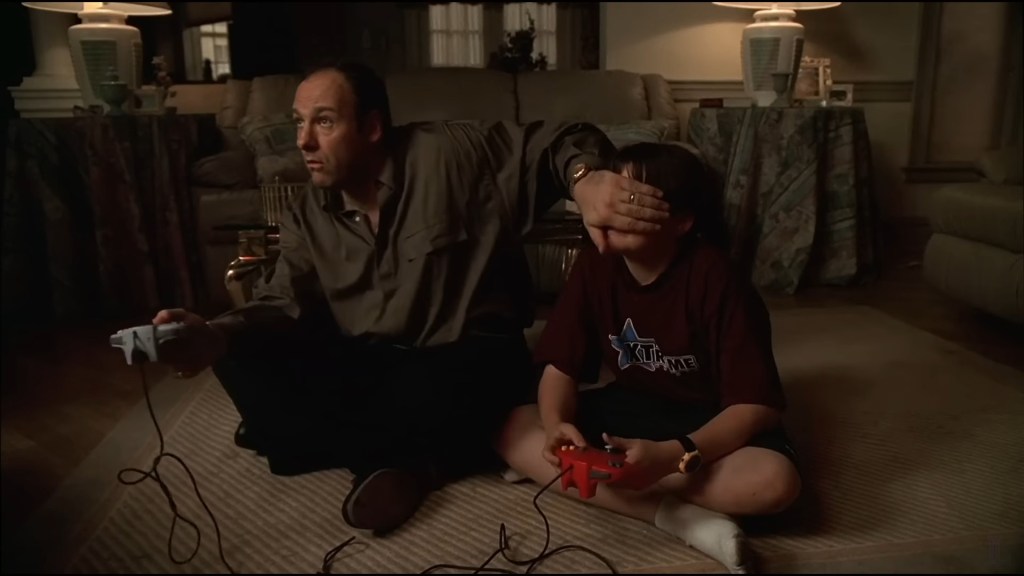Tony (James Gandolfini) cheats at Mario Kart 64 against AJ (Robert Iler) in The Sopranos Season 1 Episode 4 "Meadowlands" (1999), HBO