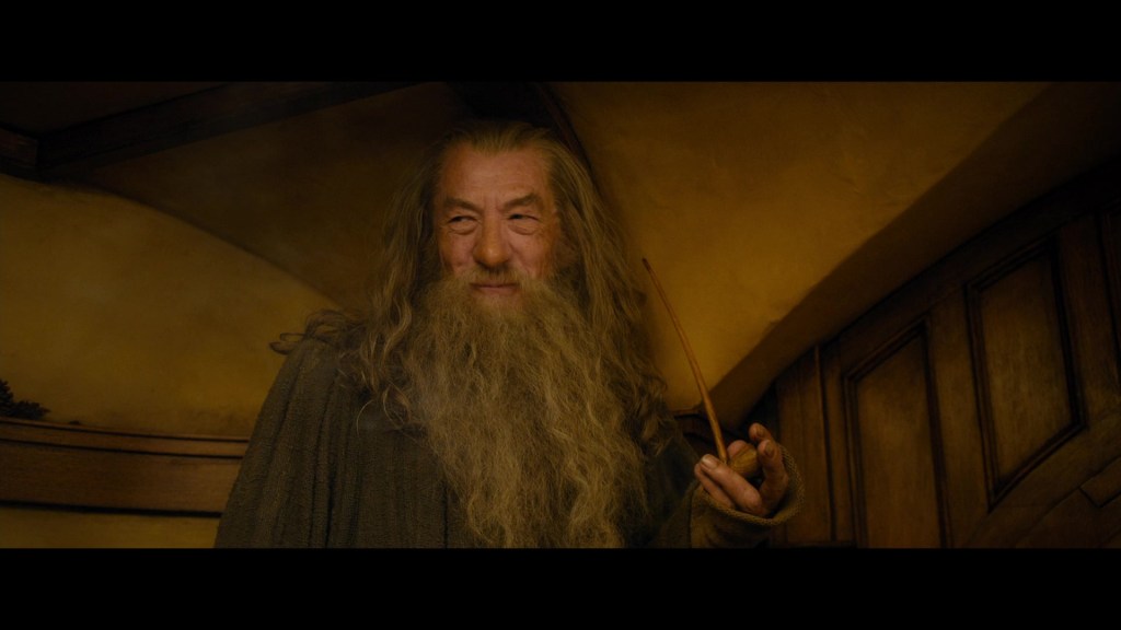 Gandalf (Sir Ian McKellen) attends a Dwarven dinner at the home of Bilbo Baggins (Martin Freeman) in The Hobbit: An Unexpected Journey (2012), New Line Cinema
