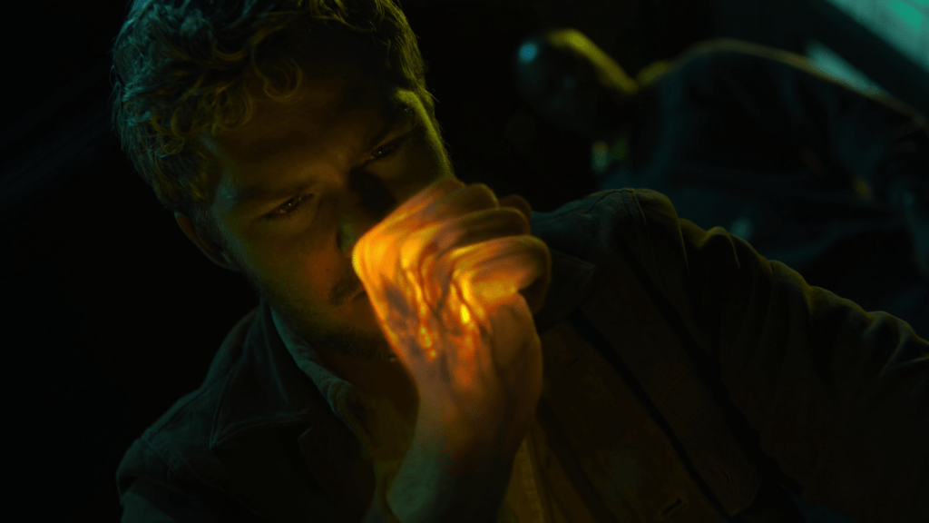 Danny Rand (Finn Jones) prepares to clock Luke Cage (Mike Colter) with his signature Iron Fist in Marvel's The Defenders Season 1 Episode 2 "Mean Right Hook" (2017), Marvel Entertainment