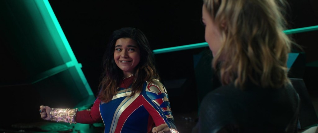 Kamala Khan (Iman Vellani) assures Captain Marvel (Brie Larson) of her ability to wield the Quantum Bands in The Marvels (2023), Marvel Entertainment