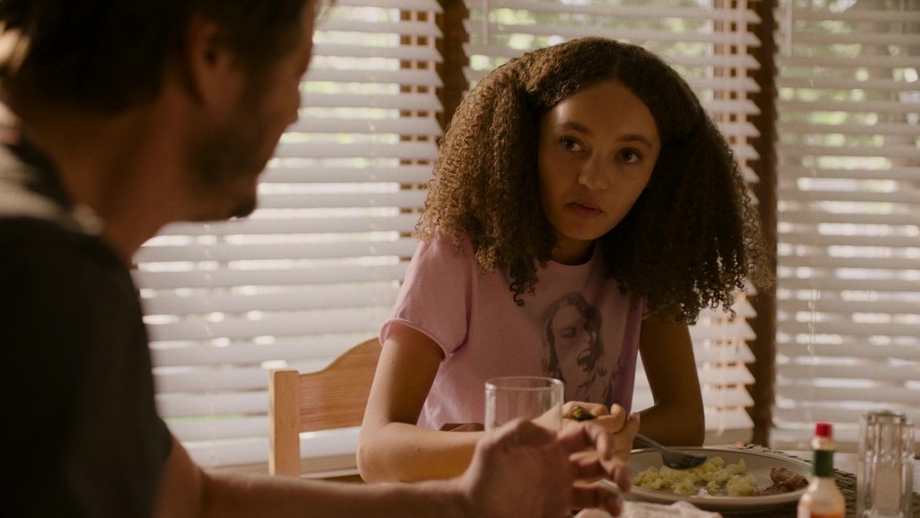 Sarah (Nico Parker) chats with her father Joel (Pedro Pascal) over breakfast in The Last of Us Season 1 Episode 1 "When You're Lost in the Darkness" (2023), HBO