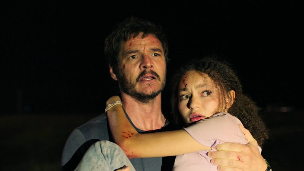 Joel (Pedro Pascal) and Sarah (Nico Parker) come across a military checkpoint in The Last of Us Season 1 Episode 1 "When You're Lost in the Darkness" (2023), HBO