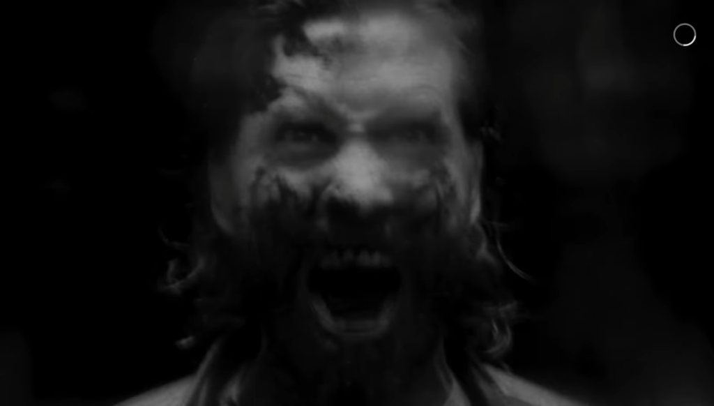 A Horror Flash shows a bloodied and screaming Alan Wake (Ilkka Villi, Matthew Porretta) in Alan Wake II (2023), Epic Games