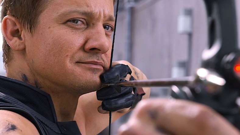 Hawkeye (Jeremy Renner) has his eyes on Loki (Tom Hiddleston) in The Avengers (2012), Marvel Studios