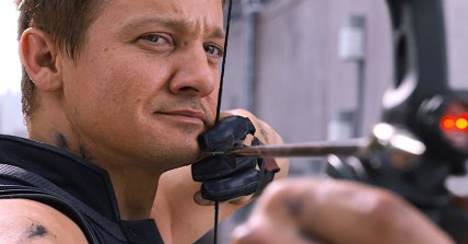 Hawkeye (Jeremy Renner) has his eyes on Loki (Tom Hiddleston) in The Avengers (2012), Marvel Studios