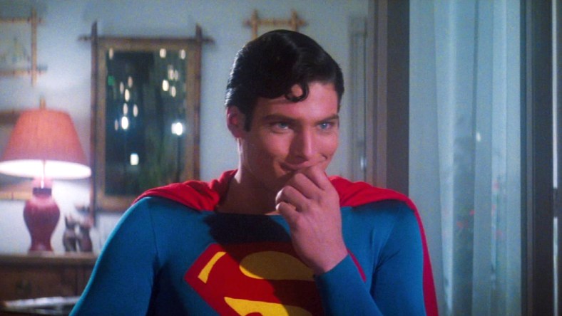 Superman (Christopher Reeve) is amused by something Lois (Margot Kidder) asks in Superman: The Movie (1978), Warner Bros. Pictures