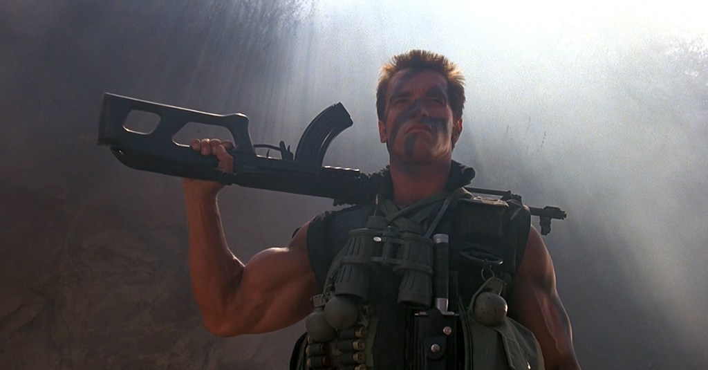 John Matrix (Arnold Schwarzenegger) prepares for war in Commando (1985), 20th Century Fox