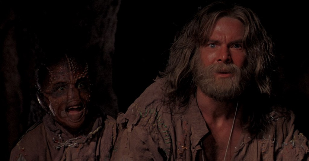 Davidge (Dennis Quaid) and Zammis (Bumper Robinson) spot a Scavenger ship in Enemy Mine (1985), 20th Century Fox