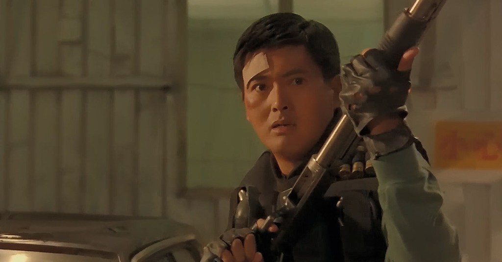 Tequila (Chow Yun-fat) during a heated gun battle in Hard Boiled (1992), Golden Princess Film Production