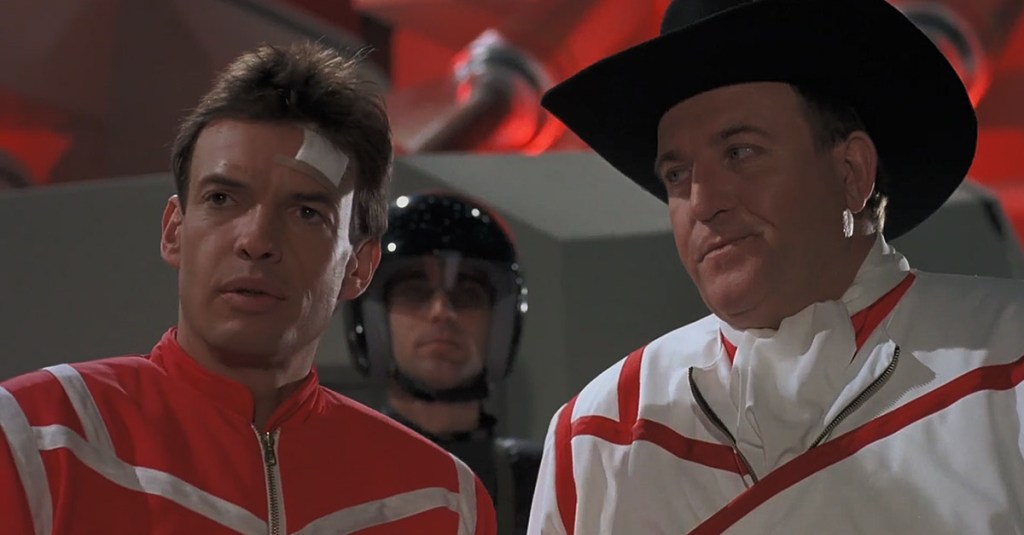 Achilles (Gary Graham) and Tex Conway (Michael Alldredge) are briefed before battle in Robot Jox (1990), Empire Pictures