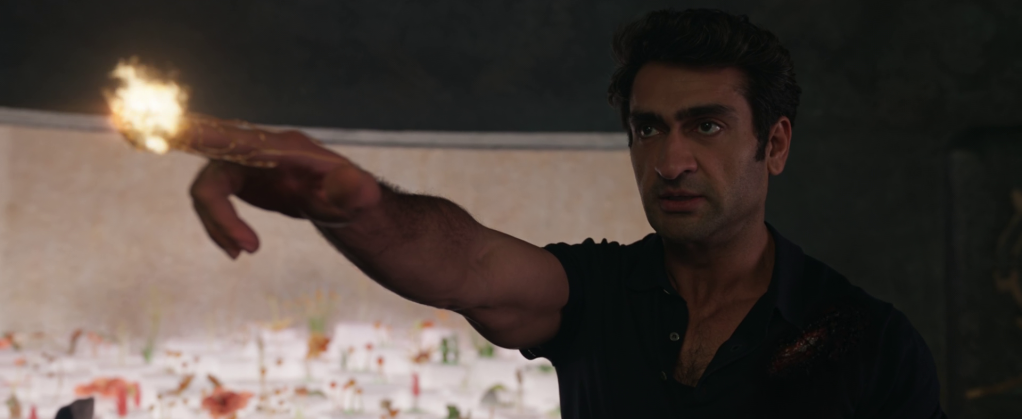 Kingo (Kumail Nanjiani) learns the truth of Ajak's (Salma Hayek) death in Eternals (2021), Marvel Entertainment