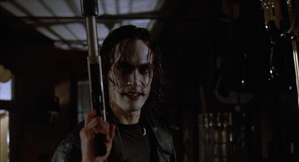Eric Draven (Brandon Lee) wants Shelby's wedding ring back from Gideon (Jon Polito) in The Crow (1994), Miramax Films