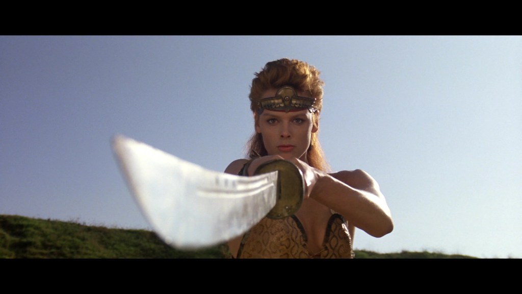 Red Sonja (Brigitte Nielsen) proves her warrior's skills in Red Sonja (1985), MGM