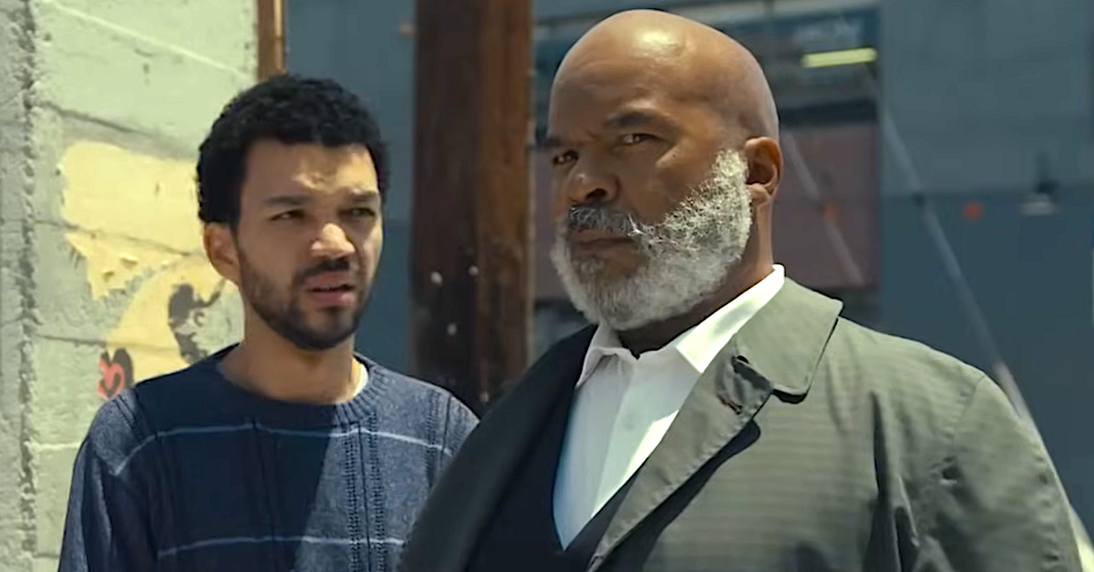 Justice Smith as Aren and David Alan Grier as Roger in The American Society of Magical Negroes (2024), Focus Features