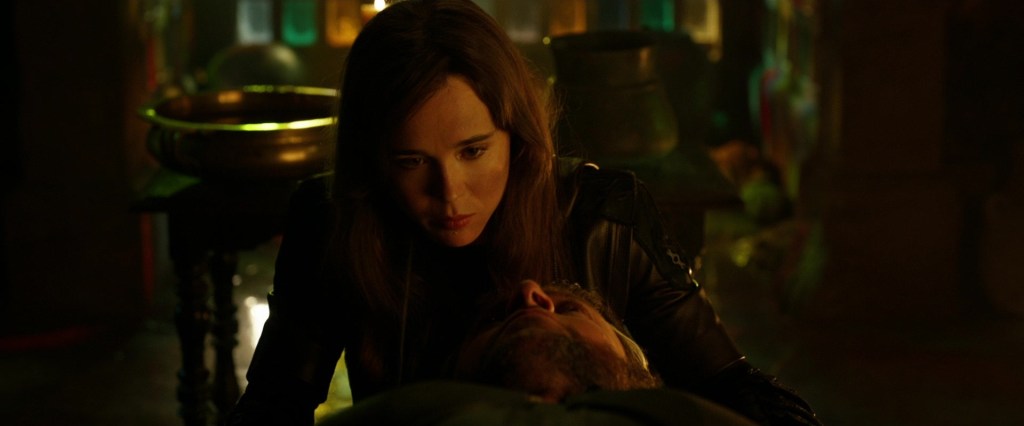 Kitty Pryde (Ellen Page) prepares Logan (Hugh Jackman) for his travel back in time in X-Men: Days of Future Past (2014), 20th Century Fox