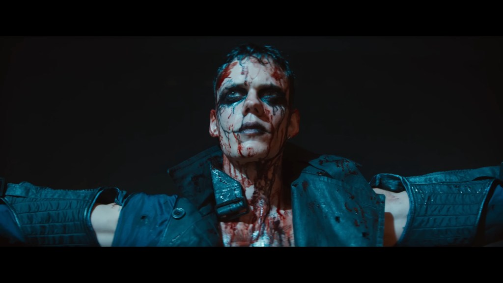 Eric Draven (Bill Skarsgård) holds for applause in The Crow (2024), Lionsgate Films
