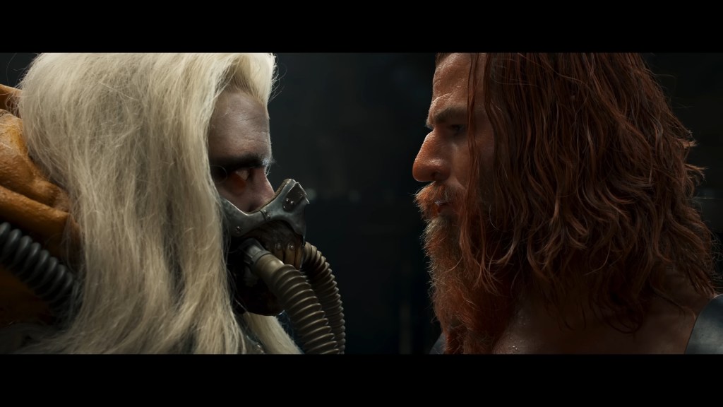 Immortan Joe (Hugh Keays-Byrne) and Warlord Dementus (Chris Hemsworth) mutually declare war upon each other in Furiosa: A Mad Max Saga (2024), Warner Bros. Pictures